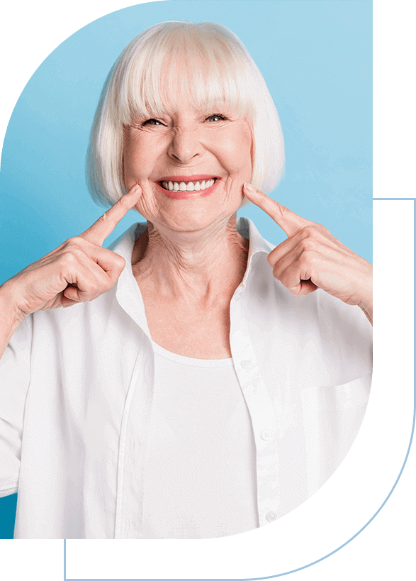 a woman smiling with her fingers on her cheeks